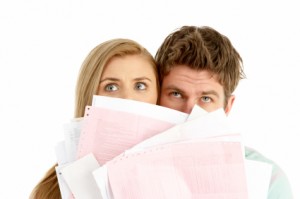 Couple Holding Stack Of Bills
